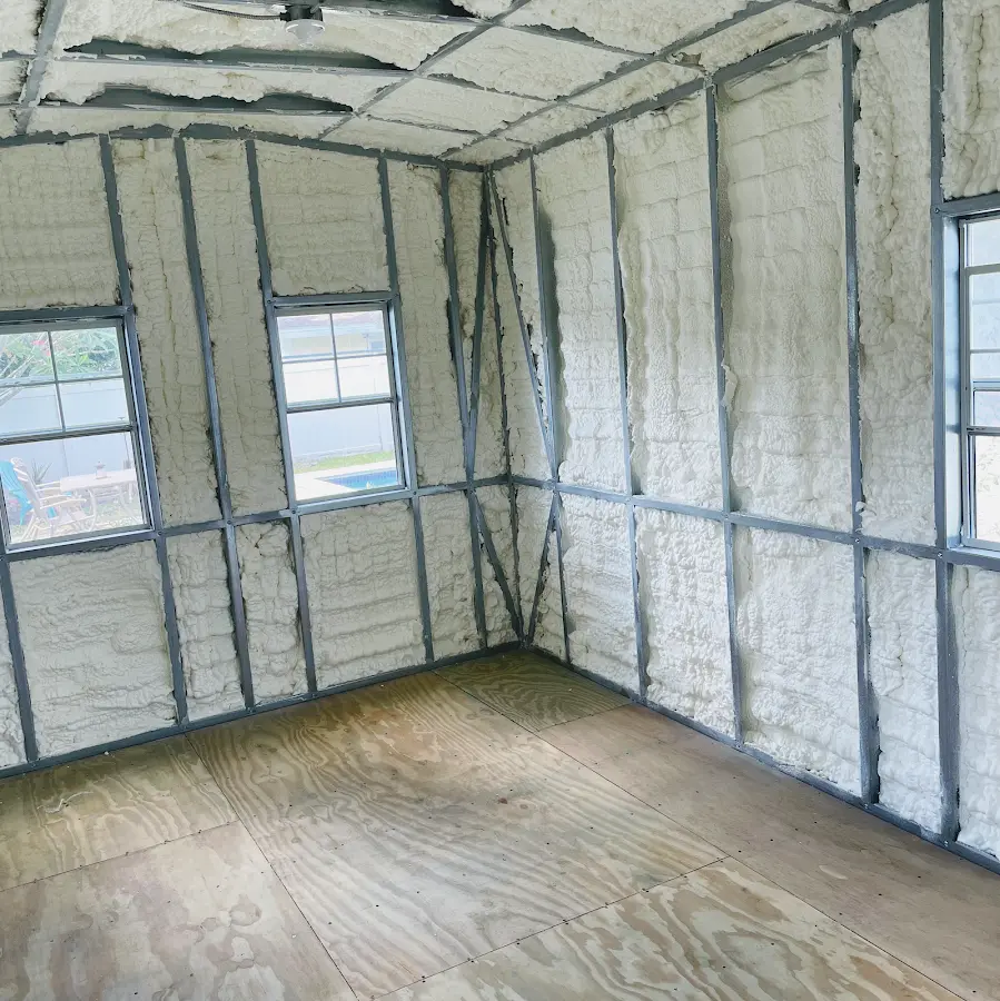 Closed-cell spray foam insulation applied to wall cavities in a residential project in Jeannette